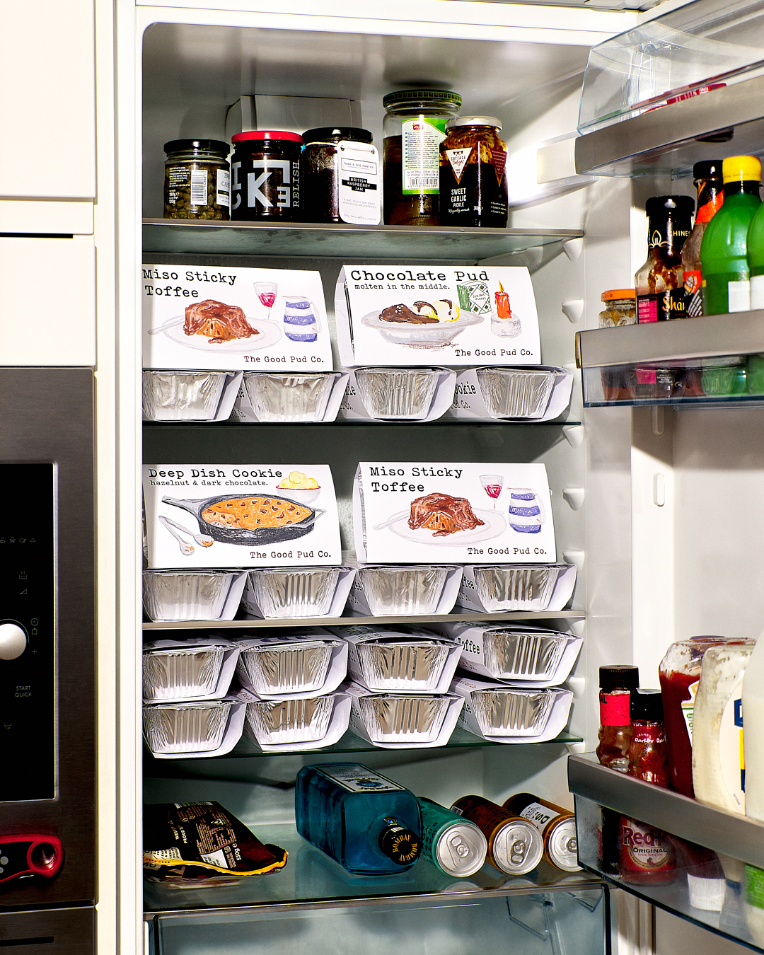 fridge stacked full of good pud co puds