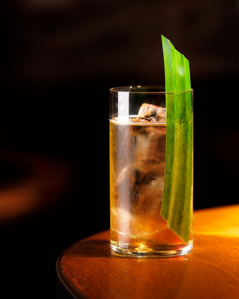 clear cocktail with pandan leaf photography